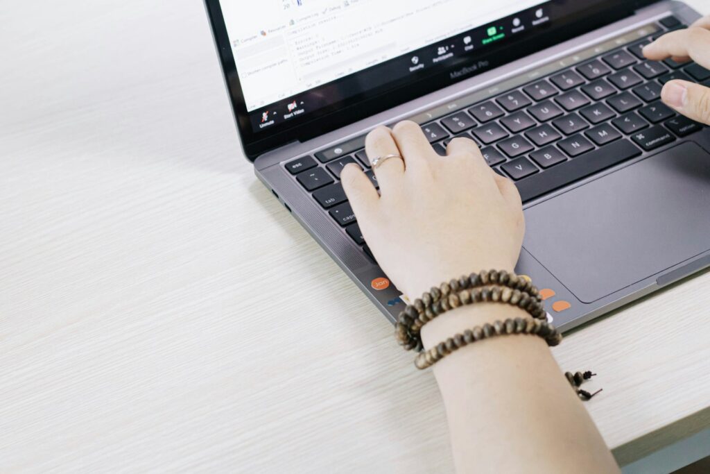 person using black and silver laptop computer