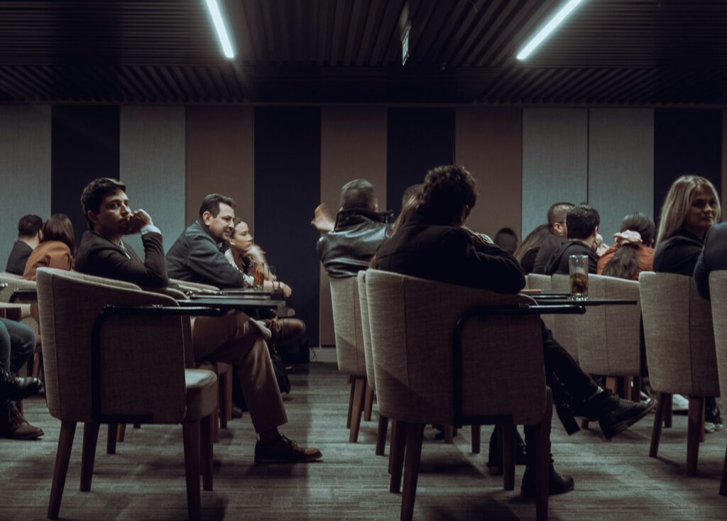 a group of people sitting at tables